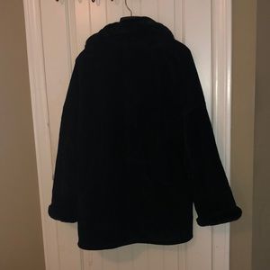 3/4 length suede shearling coat. Faux fur collar.